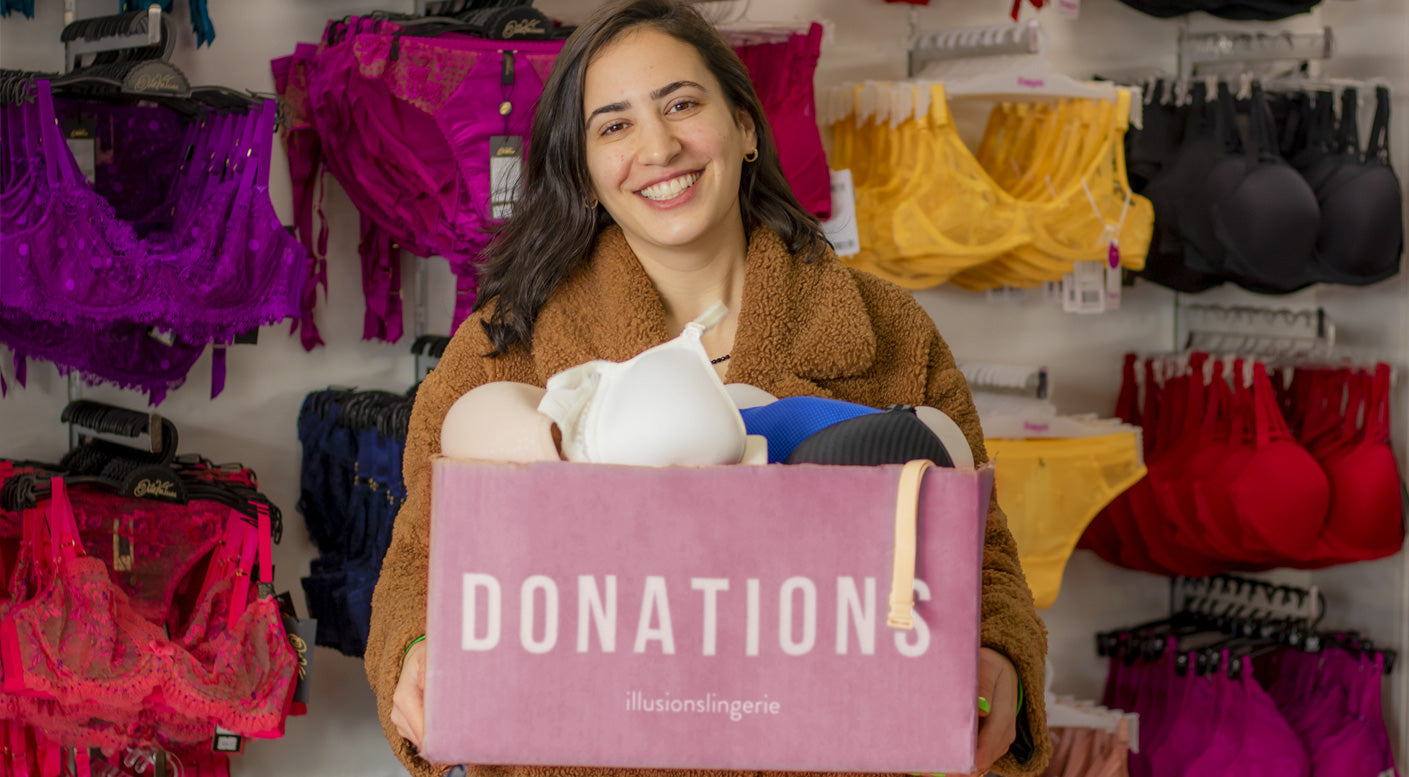 Pink donation box with beige handle branded illusions lingerie for bra donations in store collection use