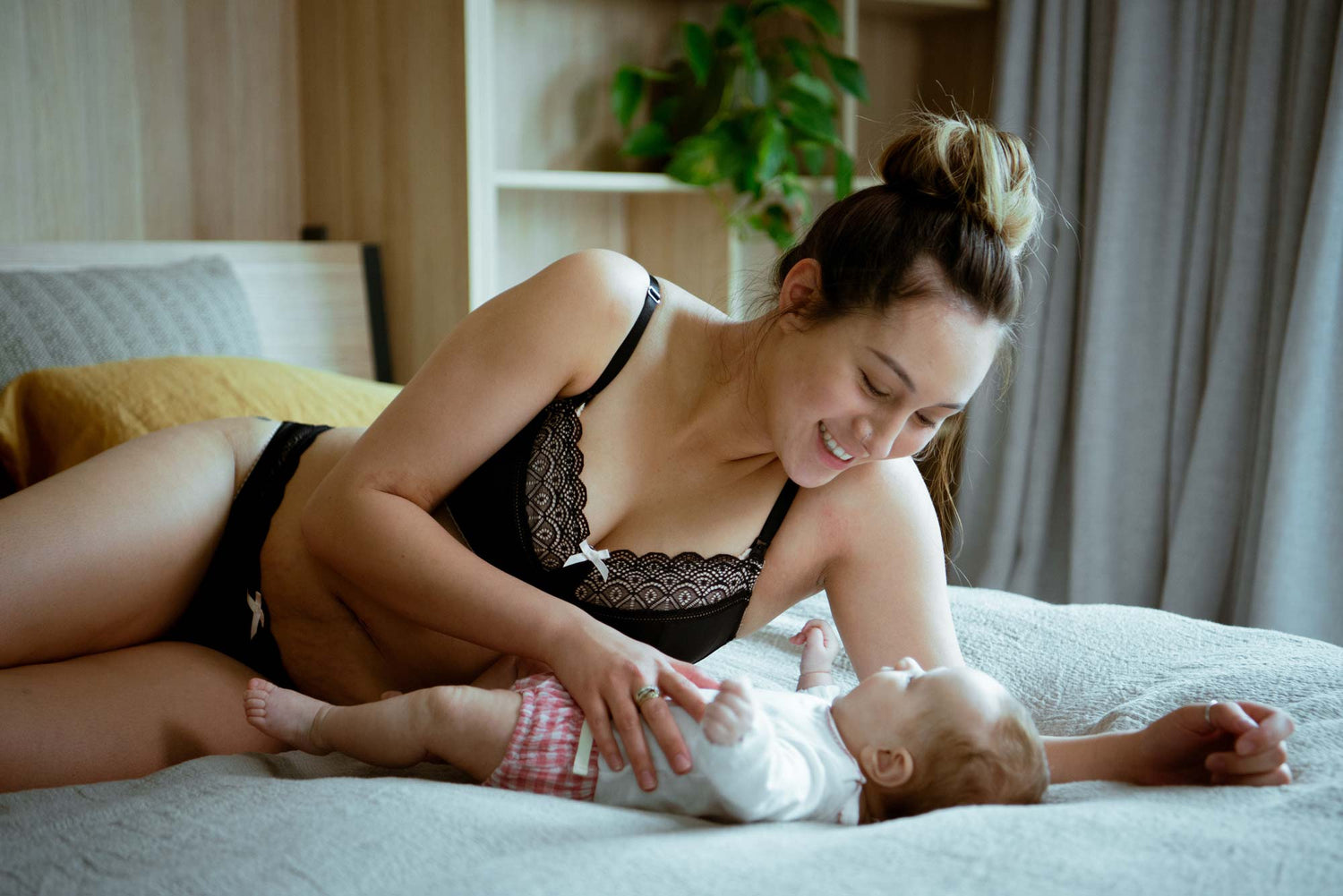 Black lace bra with delicate pattern and thin straps shown as a maternity bra for first time mums guide