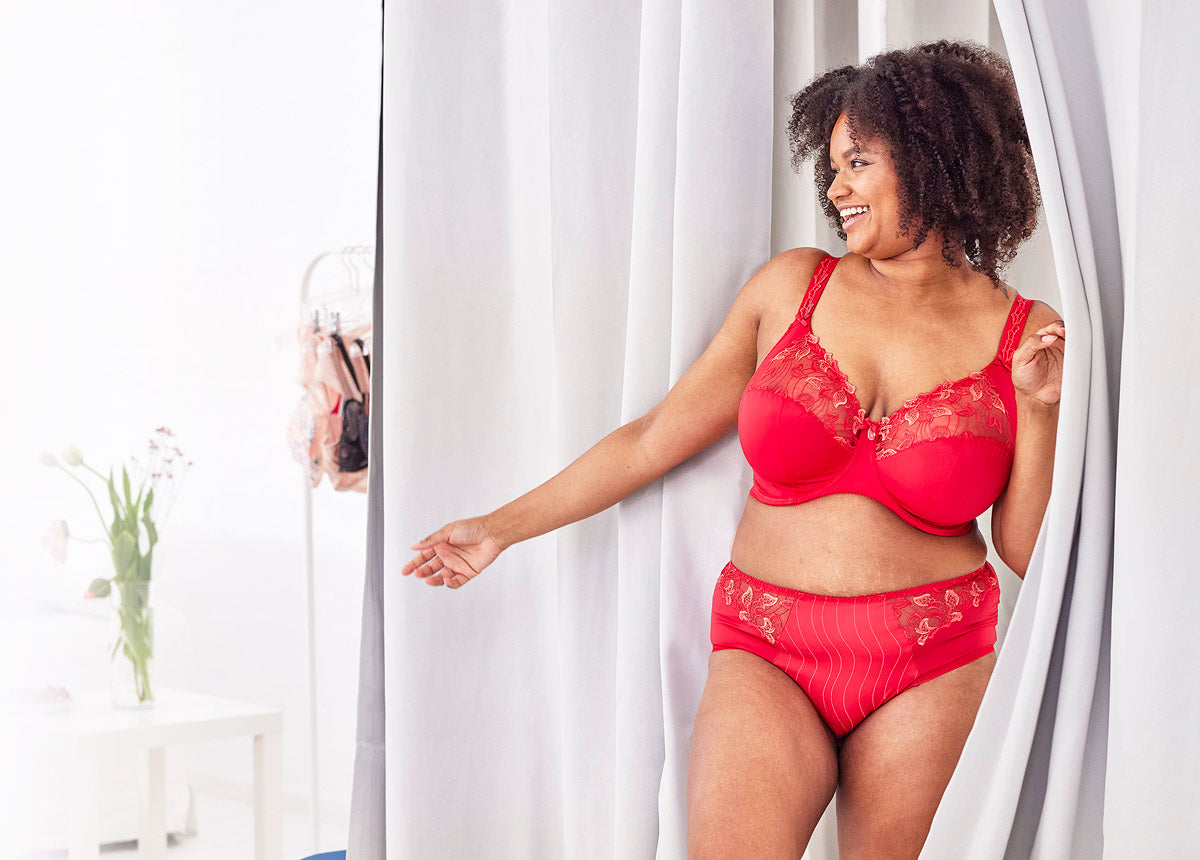 Red lace bra and matching briefs set highlighting key features for professional bra fitting guidance in article context.
