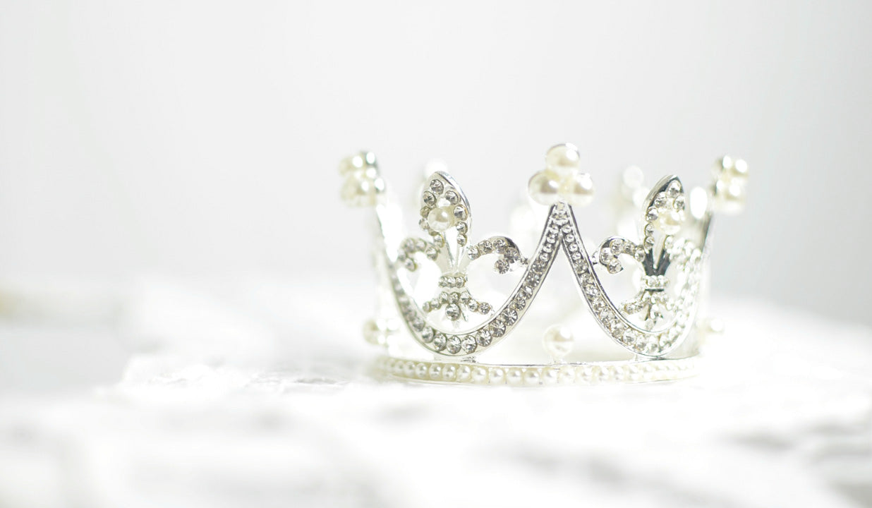 A delicate silver tiara with sparkling rhinestones and small pearl accents for the feel like a queen routine.