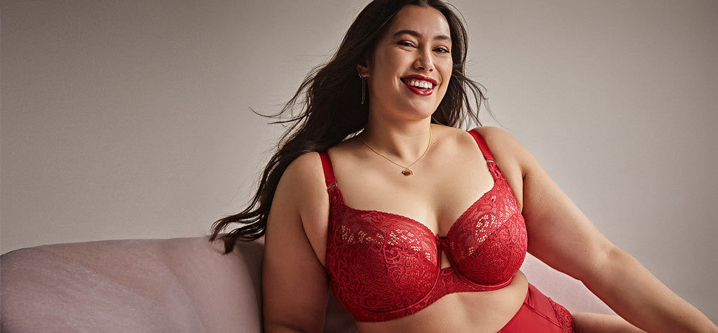 Red lace bra with intricate floral patterns and adjustable straps featured in the best lingerie brands article
