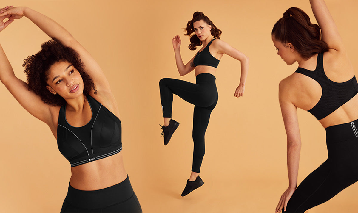 Black sports bra with white trim and logo, ideal for active lifestyles