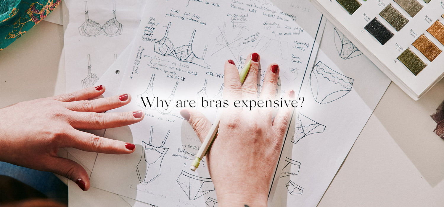Hands with red nail polish rest on paper sketches of bras and panties surrounded by fabric swatches in why are bras expensive article