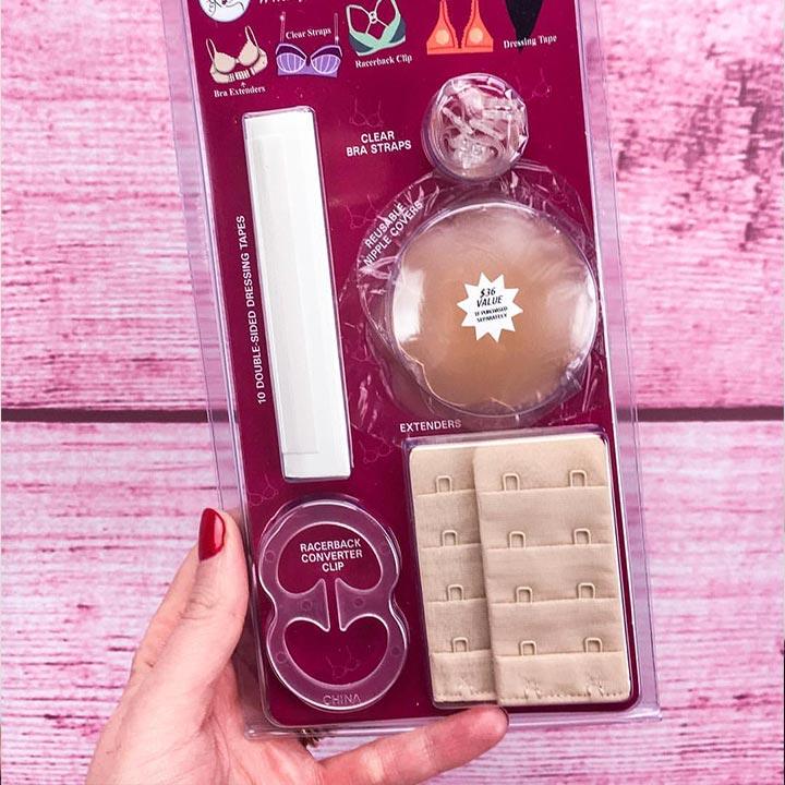 A clear plastic package of bra accessories including double-sided tapes nipple covers extender clips and racerback converter
