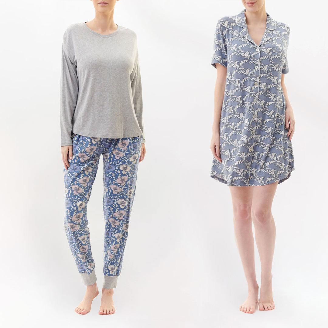 Two women model matching florence broadhurst grey pajama sets with floral blue pants and a button-up nightdress