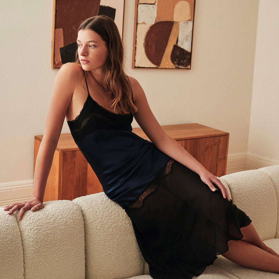 Black satin slip dress with lace trim from the ginia silk collection showcasing elegant eveningwear