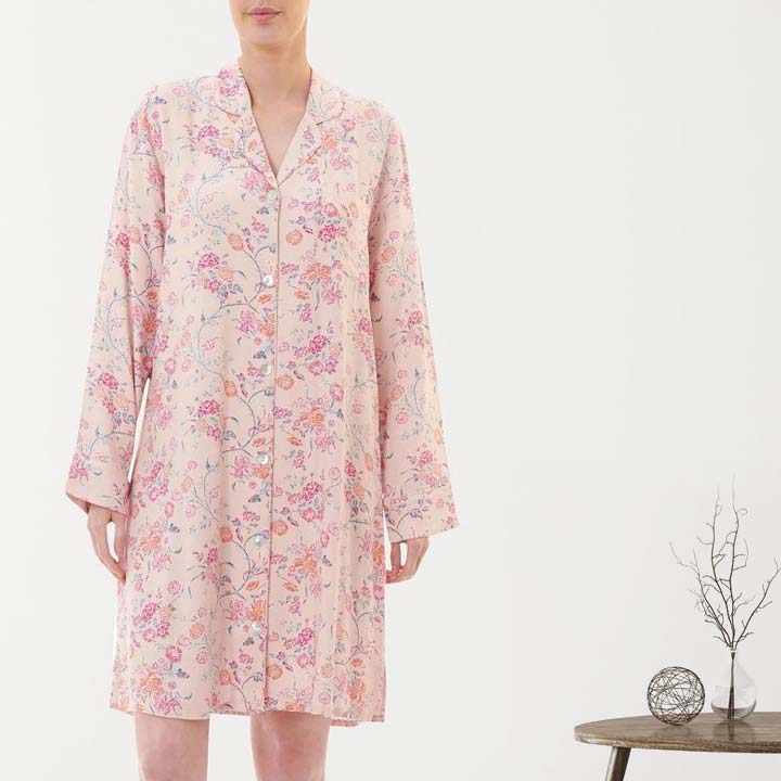 A soft pink floral print nightgown with long sleeves and button-down front from the Givoni collection.