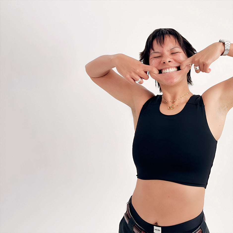 Black sleeveless crop top with rounded neckline and fitted silhouette from NOBI collection