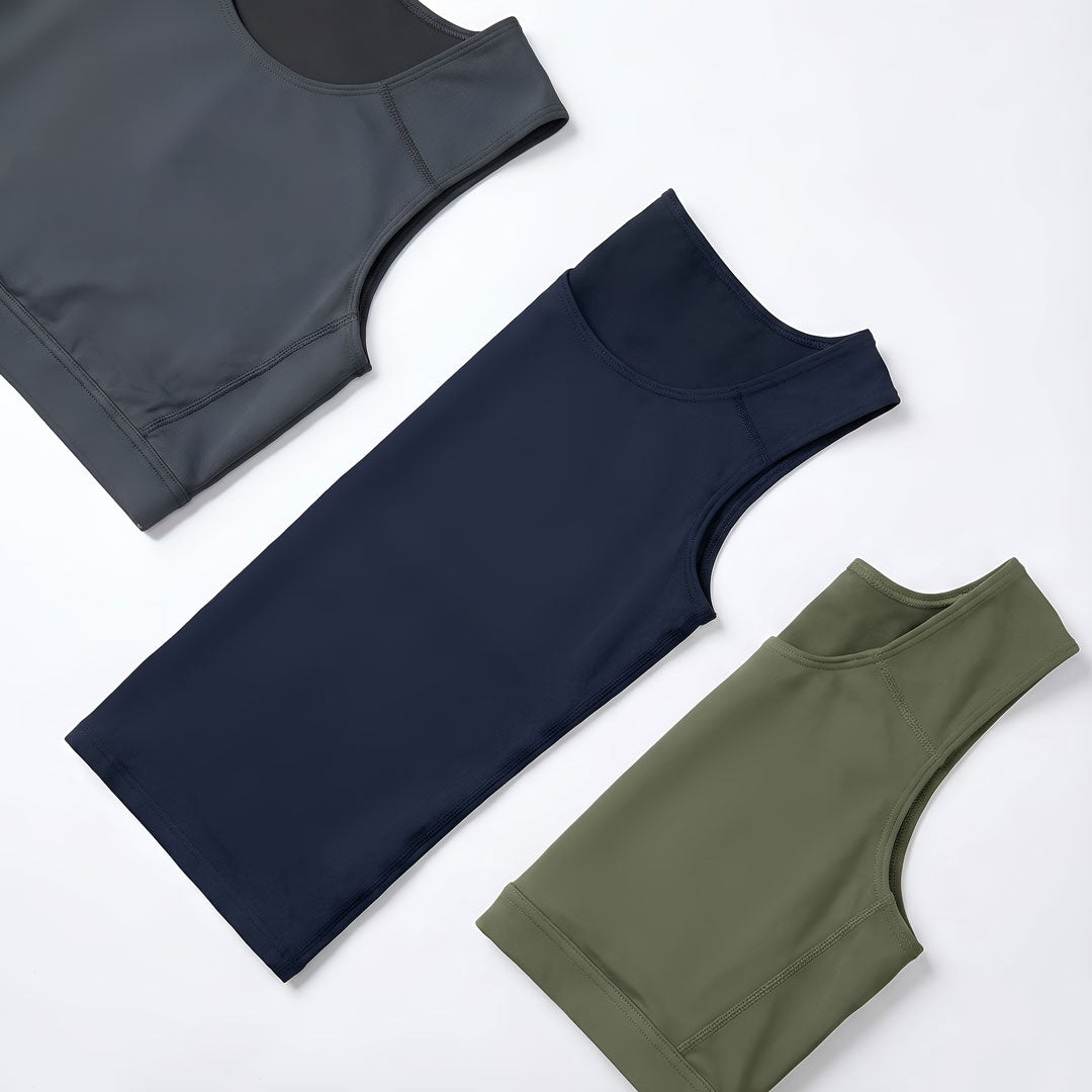 Three sleeveless athletic tops in dark gray navy blue and olive green from rodeoh made for performance and comfort