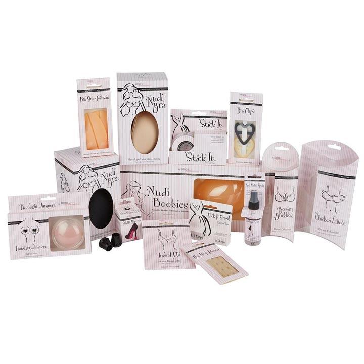 Nudi boobies silicone breast enhancer in clear window box with pink and white striped packaging from secret weapon collection