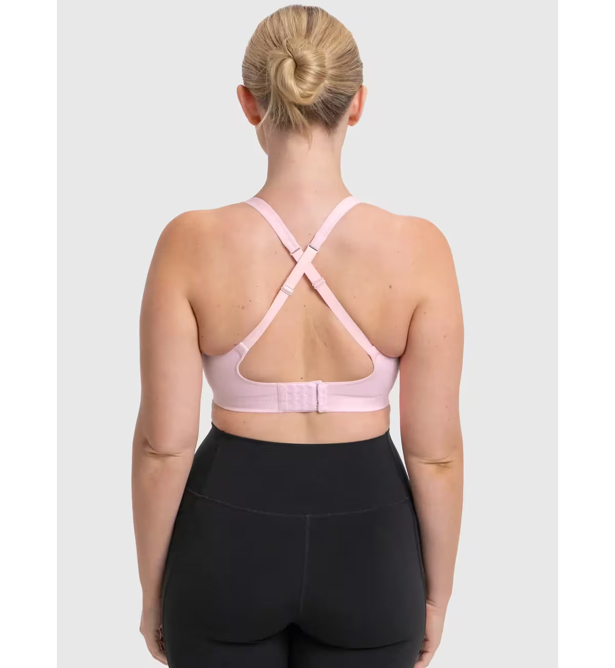 Pink Triaction Ultra Seamfree sports bra with crisscross back straps and front closure band for active support