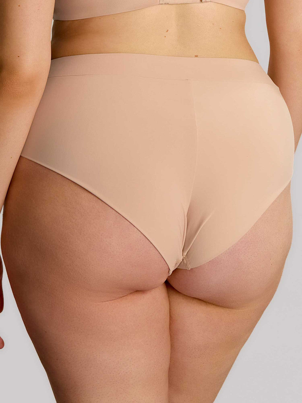 Beige high-waisted seamless body deep brief with smooth stretchy fabric for comfortable everyday wear