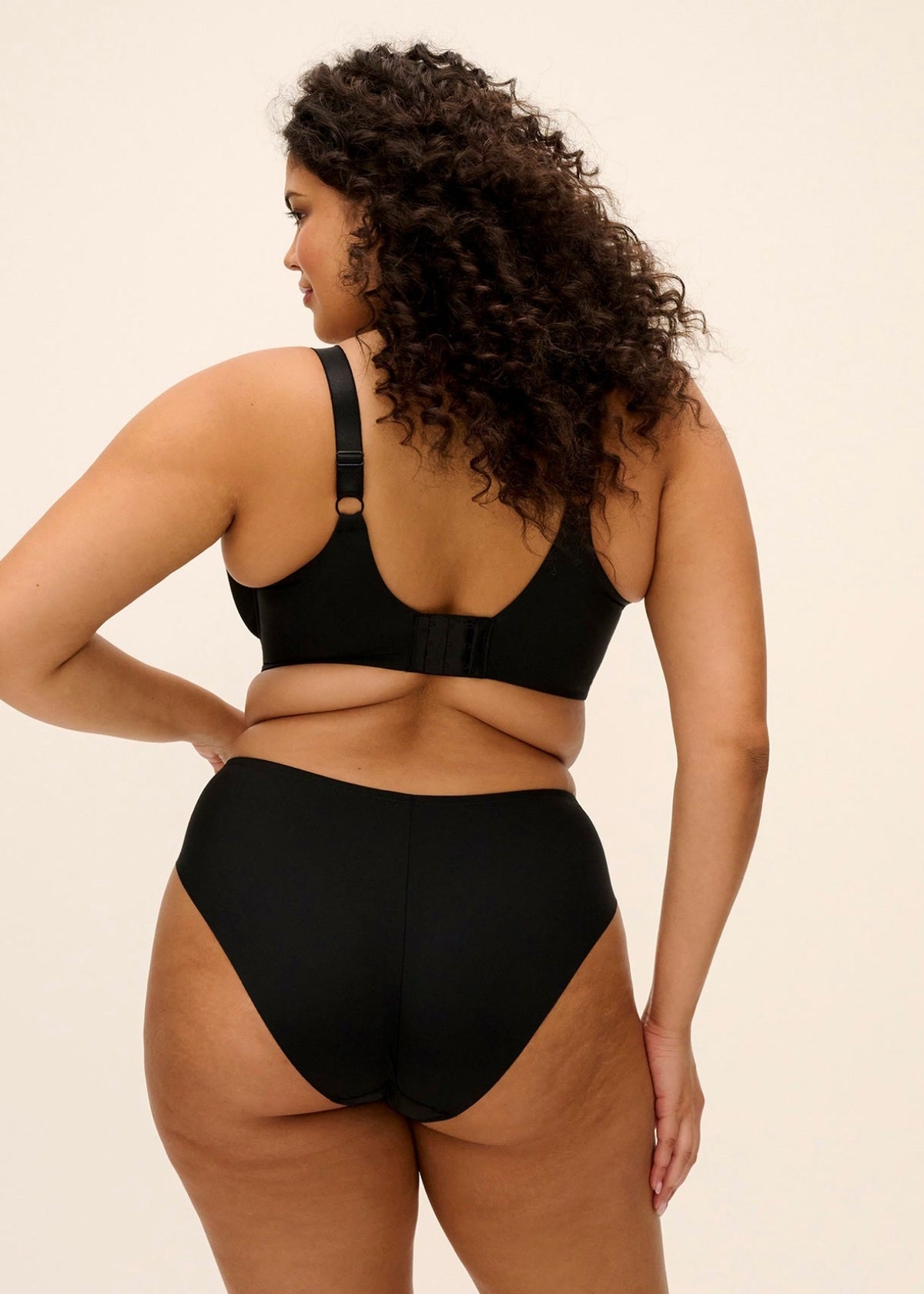 Black seamless lyriana bra and high-waisted briefs set designed for comfort and support in smooth fabric