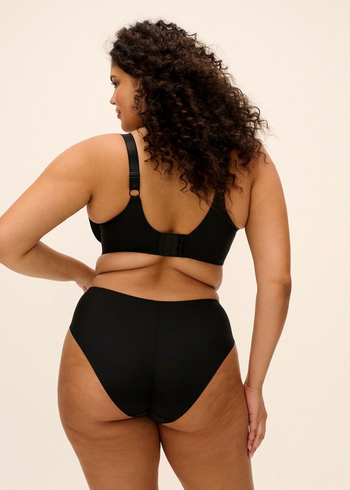 Black plus-size lyriana brief set with bra and high-waisted briefs in soft stretch fabric for comfortable support