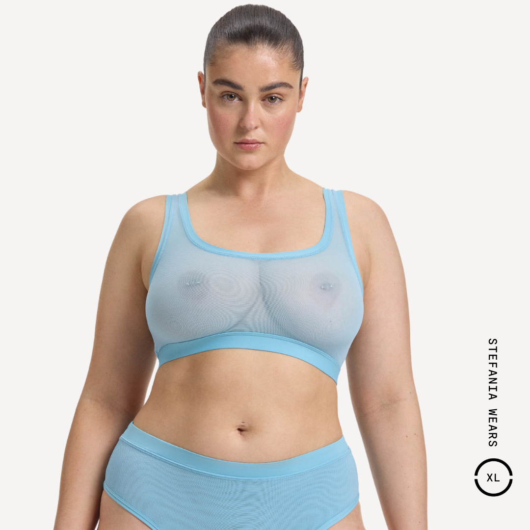 Light blue sheer mesh sports bra with solid band and high-waisted briefs