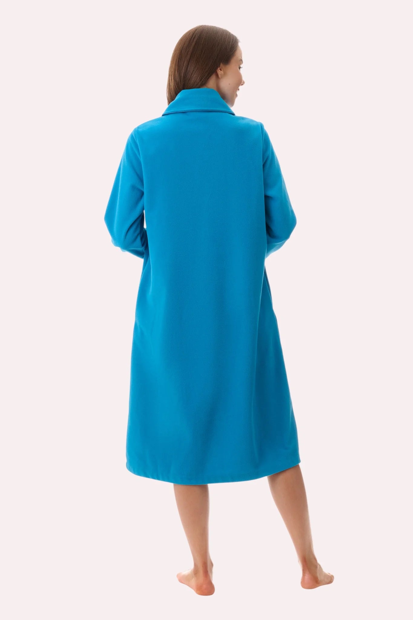 A vibrant turquoise short button gown made of wool with a classic collar and long sleeves for stylish warmth