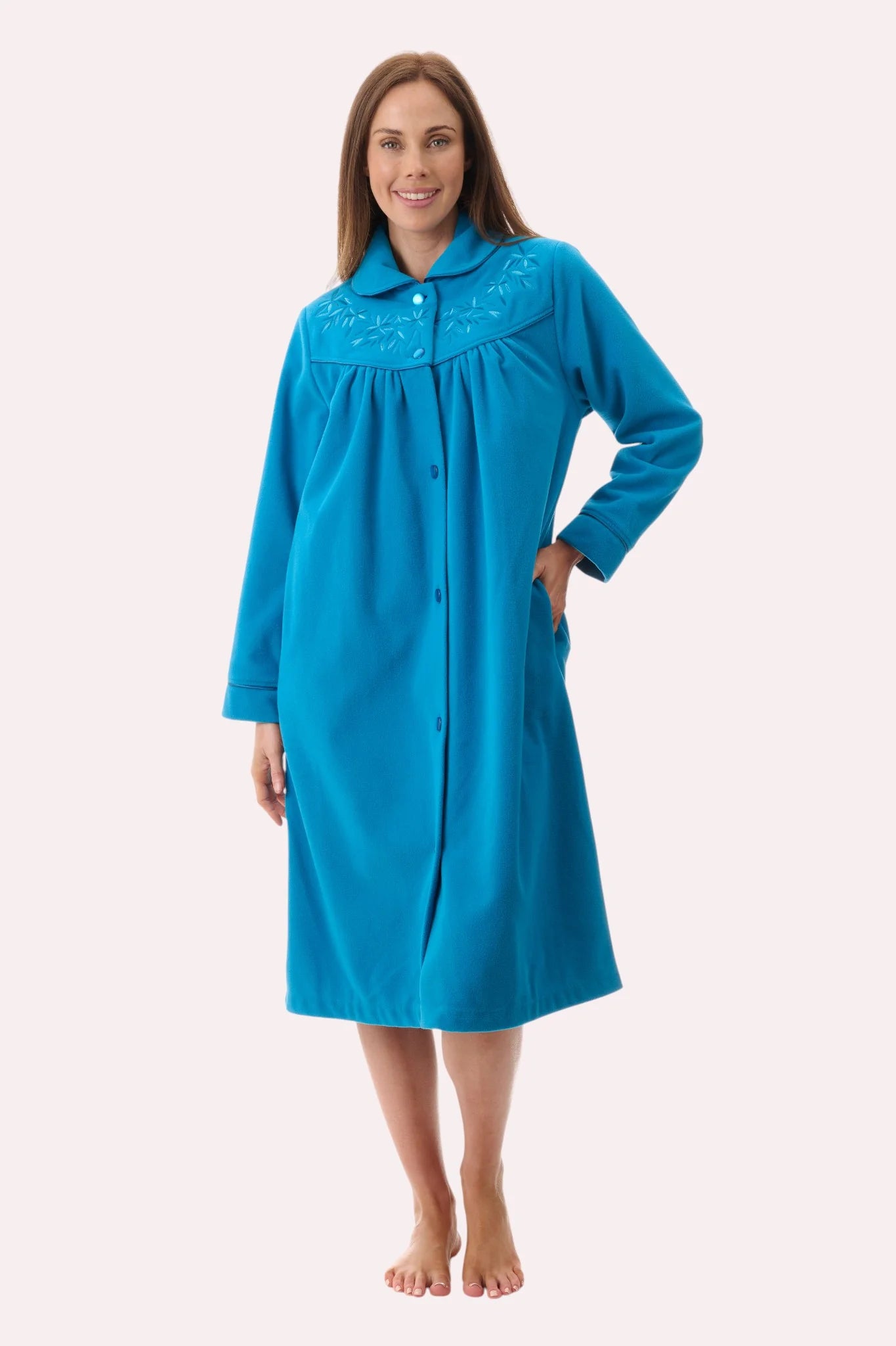 A vibrant turquoise short button gown nightgown with soft plush fabric and delicate embroidered collar detailing