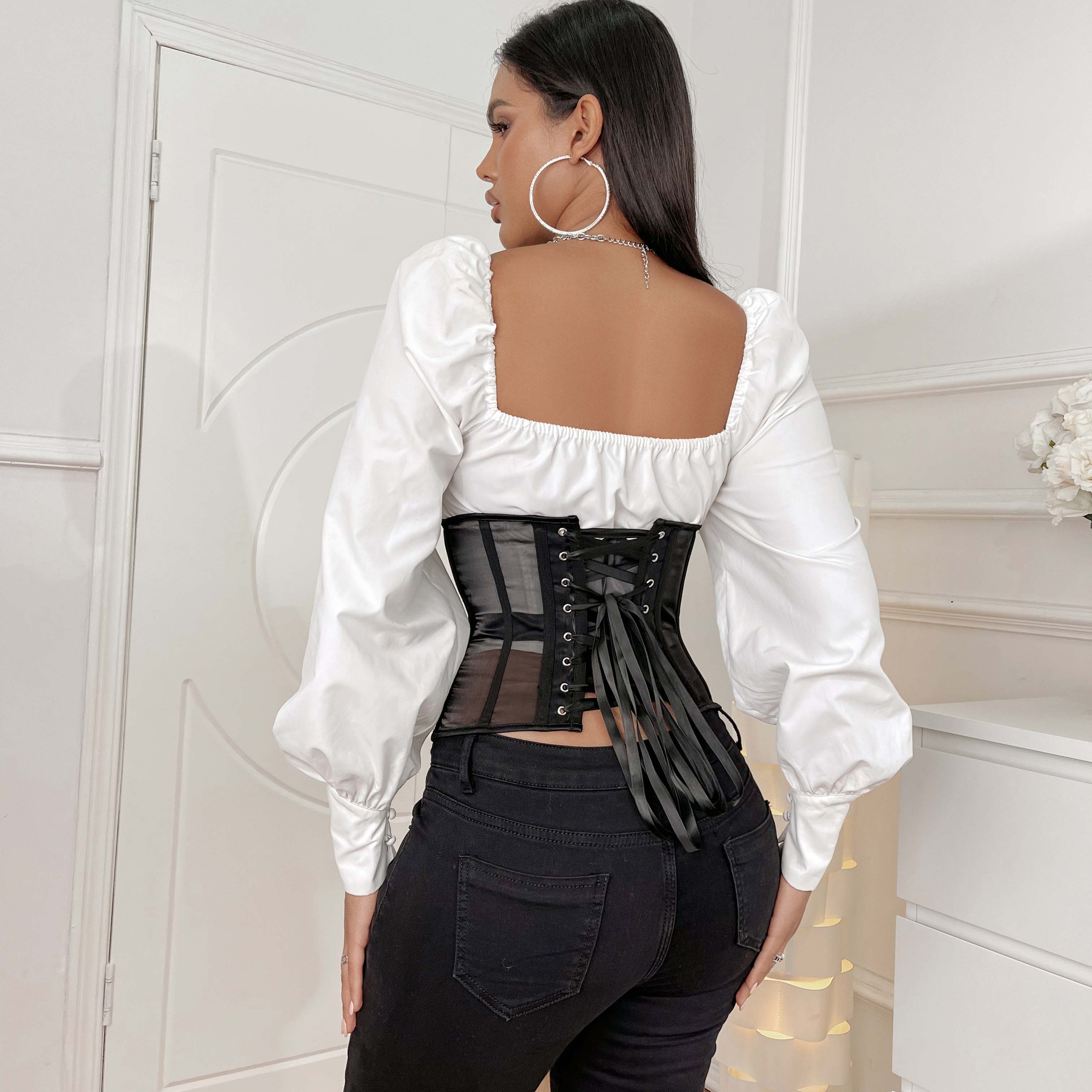 Black sheer corset made of mesh with lace-up front and dangling leather ties for a stylish edgy look