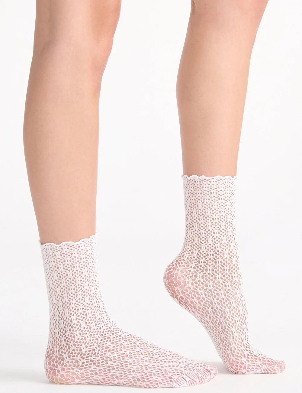 Delicate white crochet net anklets with scalloped edges and subtle pink undertones in lace ankle sock style