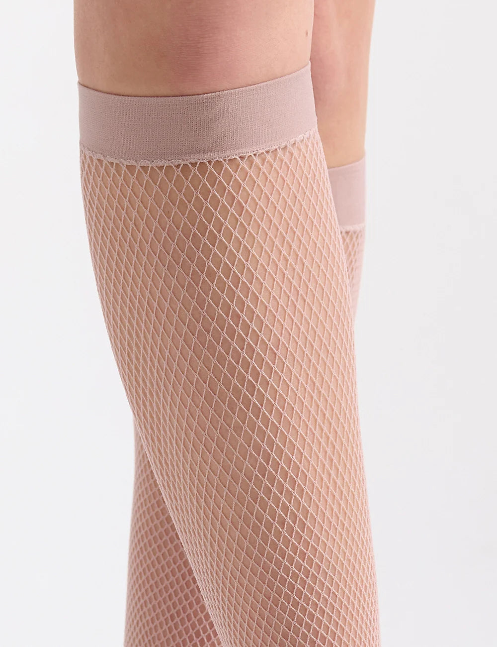 Beige fishnet knee high stockings with smooth elastic band made of breathable mesh material