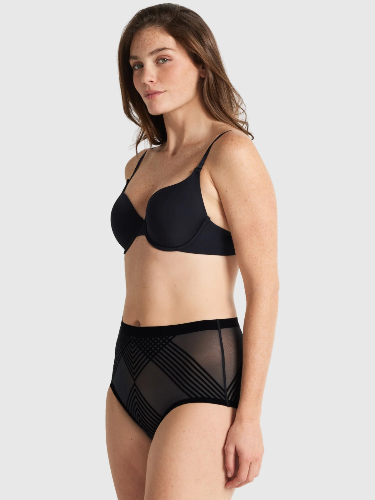 Black sheer high waisted briefs featuring a geometric black mesh pattern called sheer power waisted brief