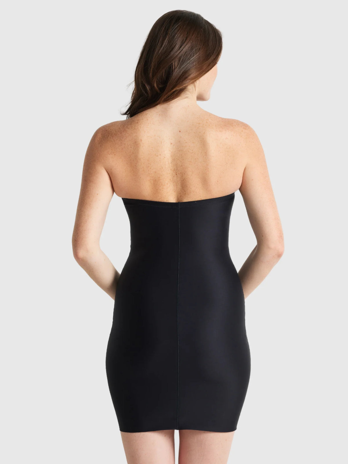 Black strapless bodycon mini dress with a smooth form-fitting silhouette from the slip edit strapless slip collection
