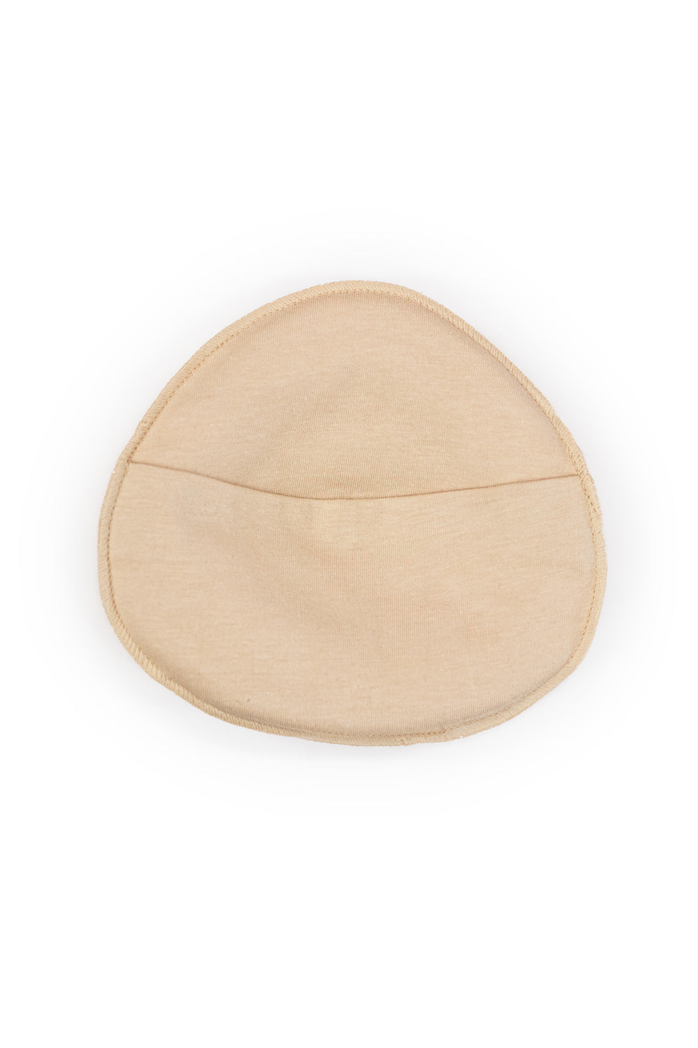 Beige breast form cover with soft padding smooth fabric finish and subtle seam detail for natural shape enhancement