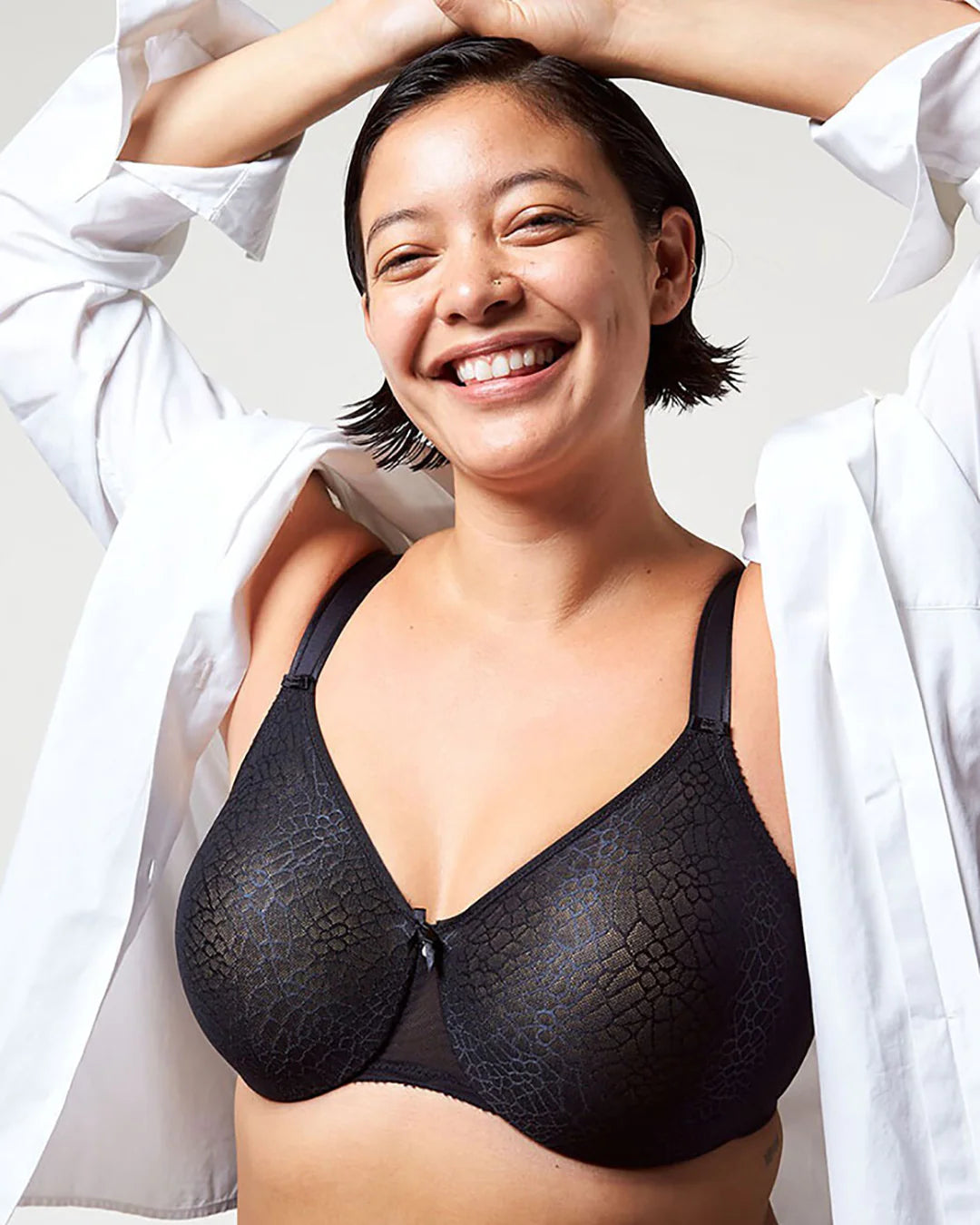Woman wearing a black minimiser bra