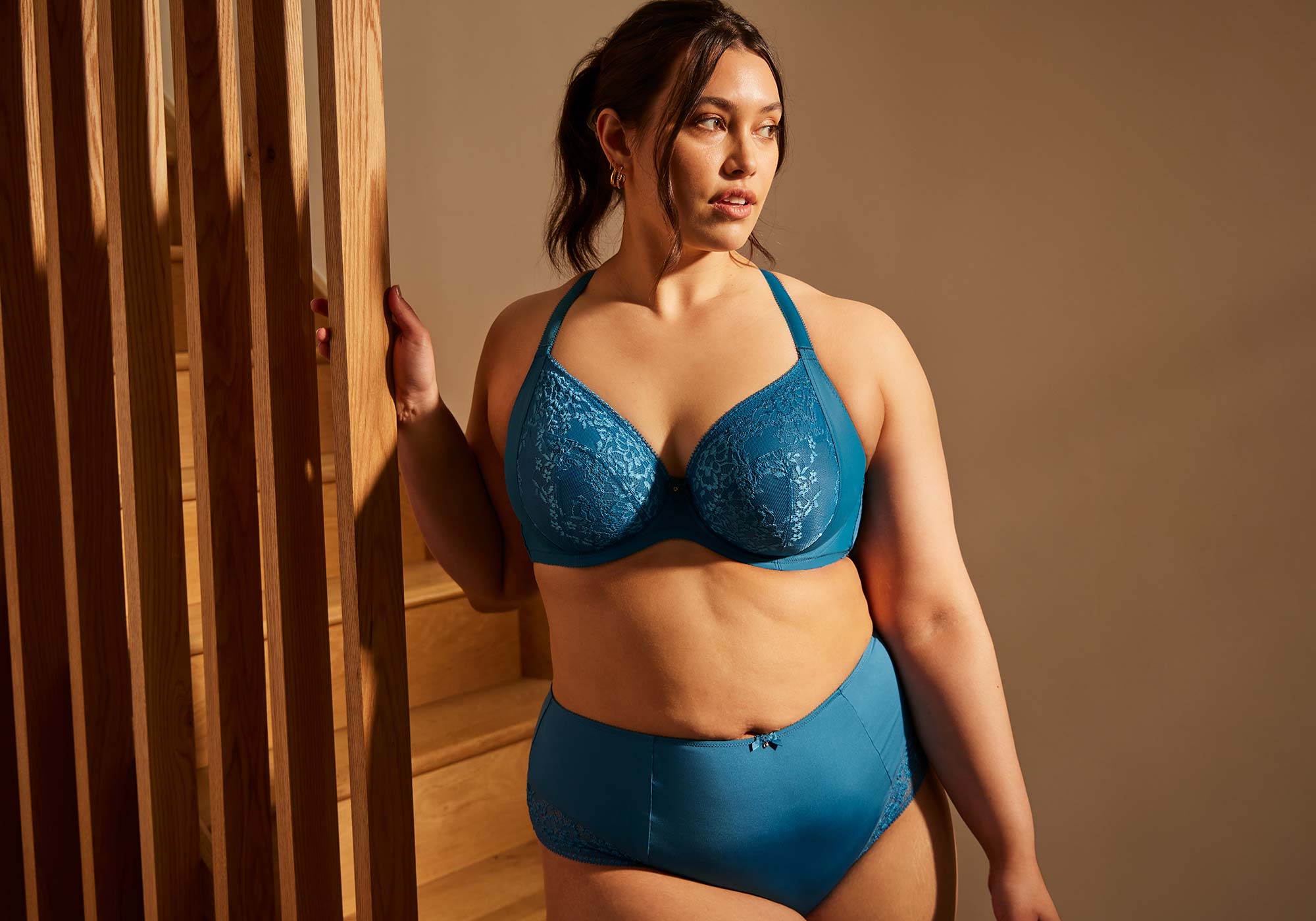 Full figure woman wearing blue plus size lingerie