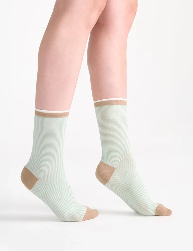 Light green ribbed ankle socks with beige toe and heel accents from the Lina Fine Stripe Crew Sock collection