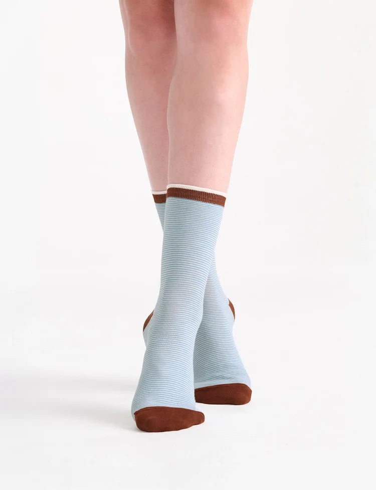 Lina fine stripe crew sock featuring light blue stripes with brown toe and heel accents in soft cotton blend