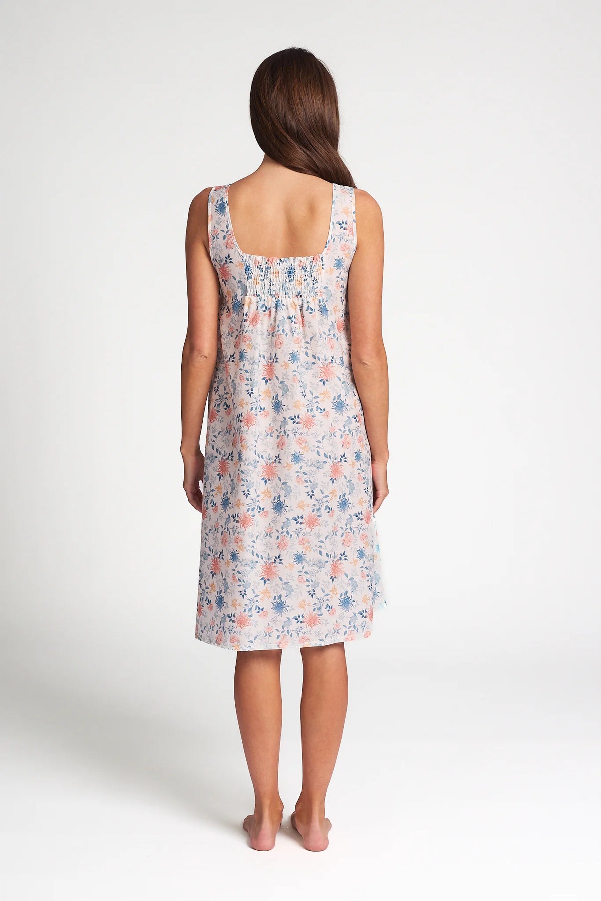 A soft sleeveless cotton silk nightie in light pastel with delicate pink and blue floral patterns