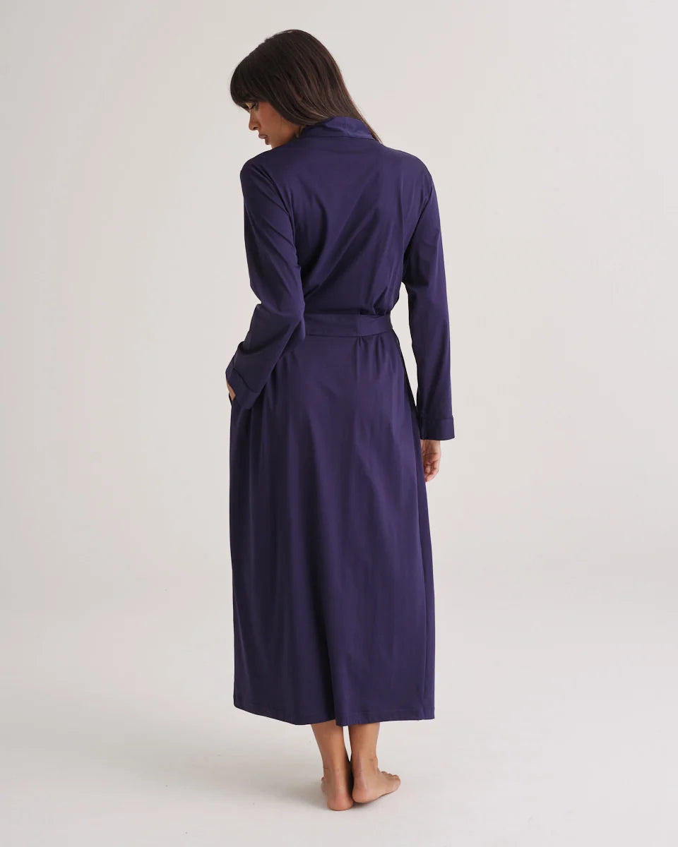 A navy blue supima cotton robe with long sleeves belted waist and side pockets for comfortable wear