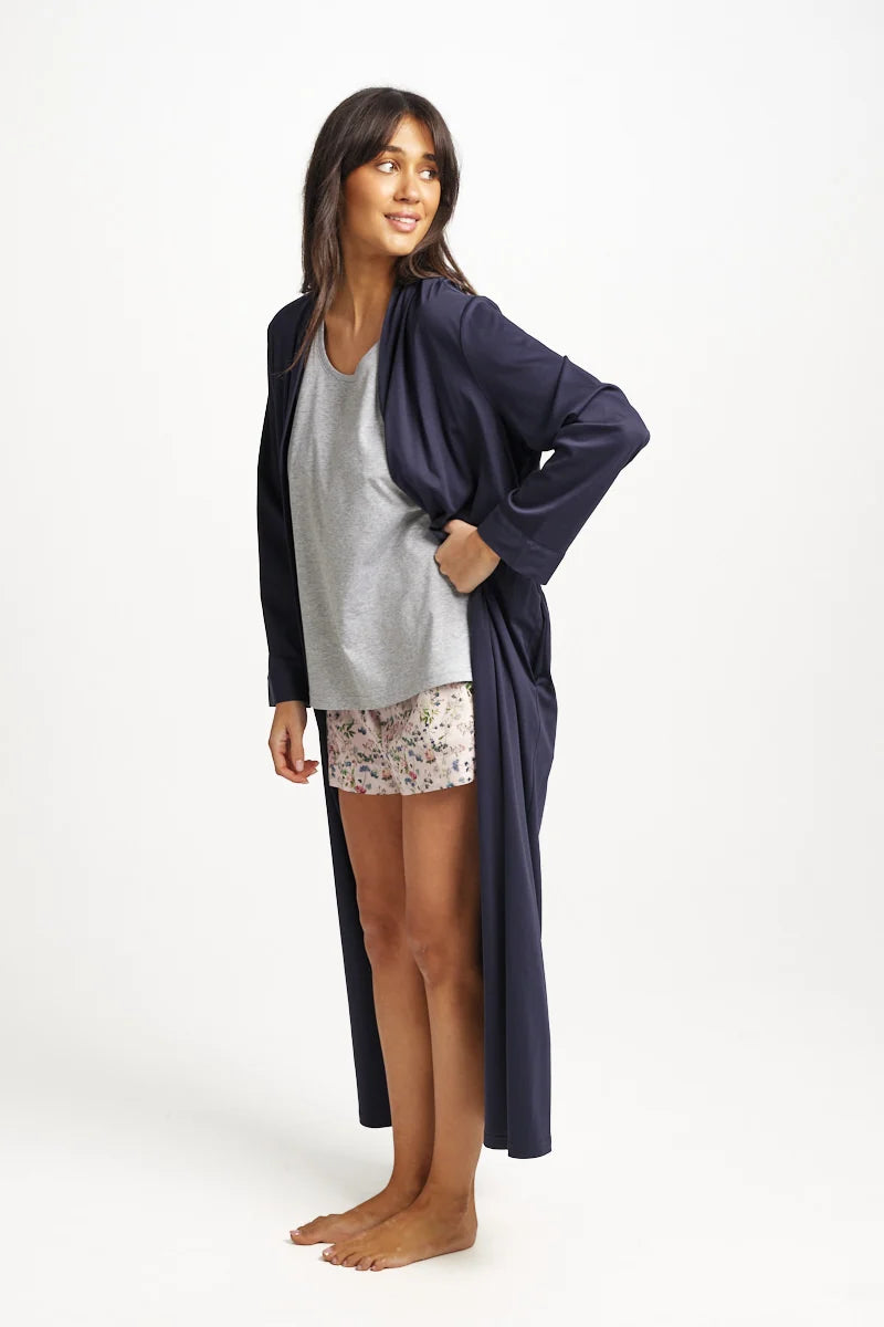 A navy blue satin supima cotton robe with a loose flowing design and long sleeves for comfortable wear