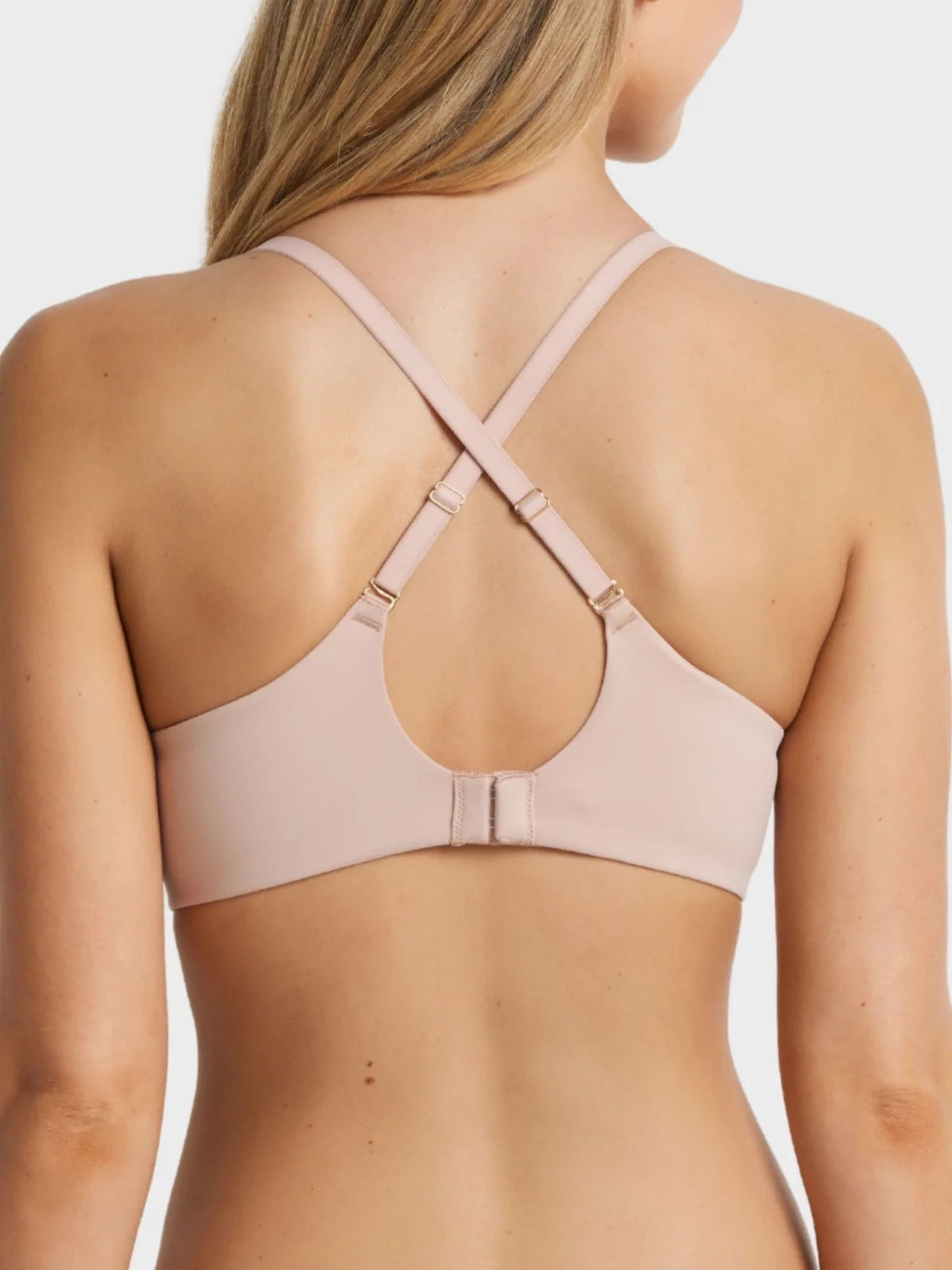 Memory t shirt bra soft blush pink seamless underwire with crisscross back strap and metallic hardware visible from back