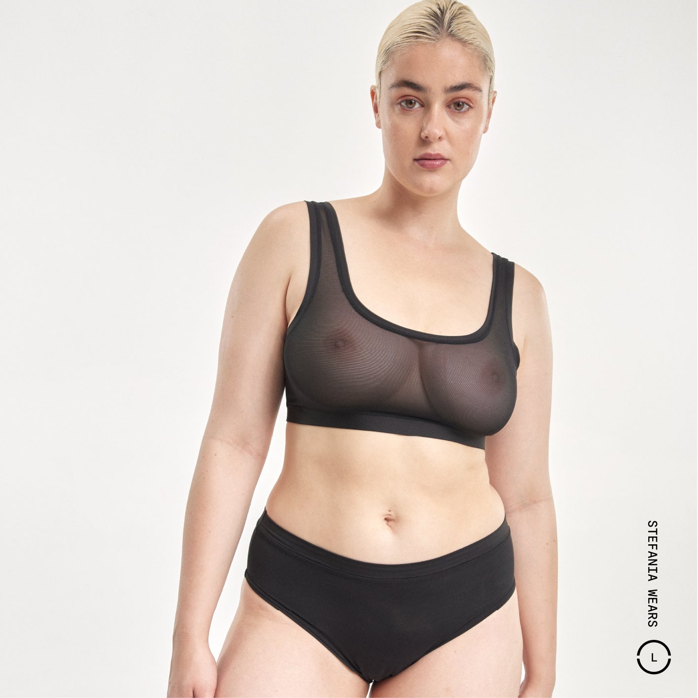 Black sheer mesh Everybody Tuck Brief with trim and high-waisted style