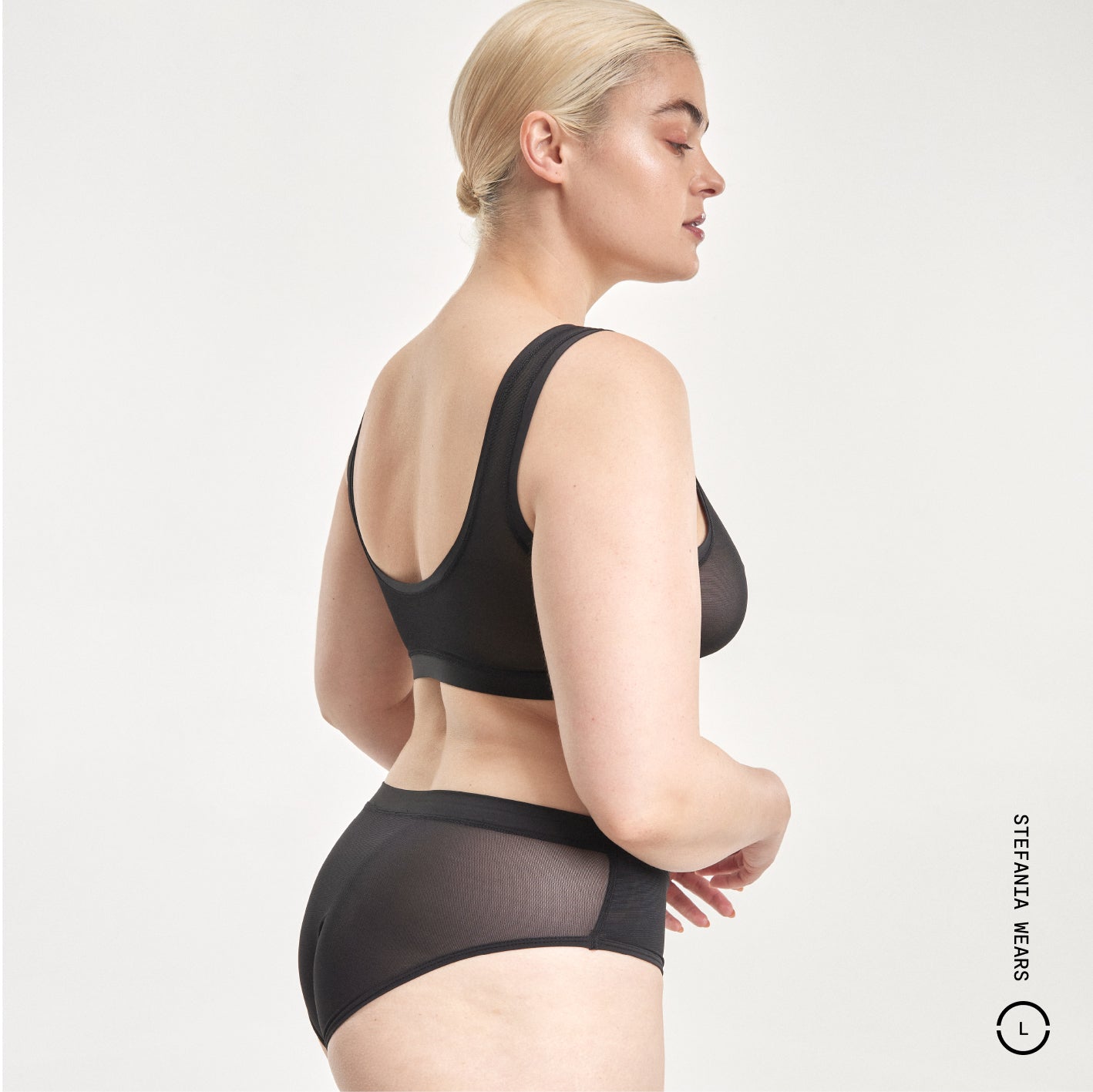 Black sheer mesh bra and matching Everybody Tuck Brief set by Stefania Wears