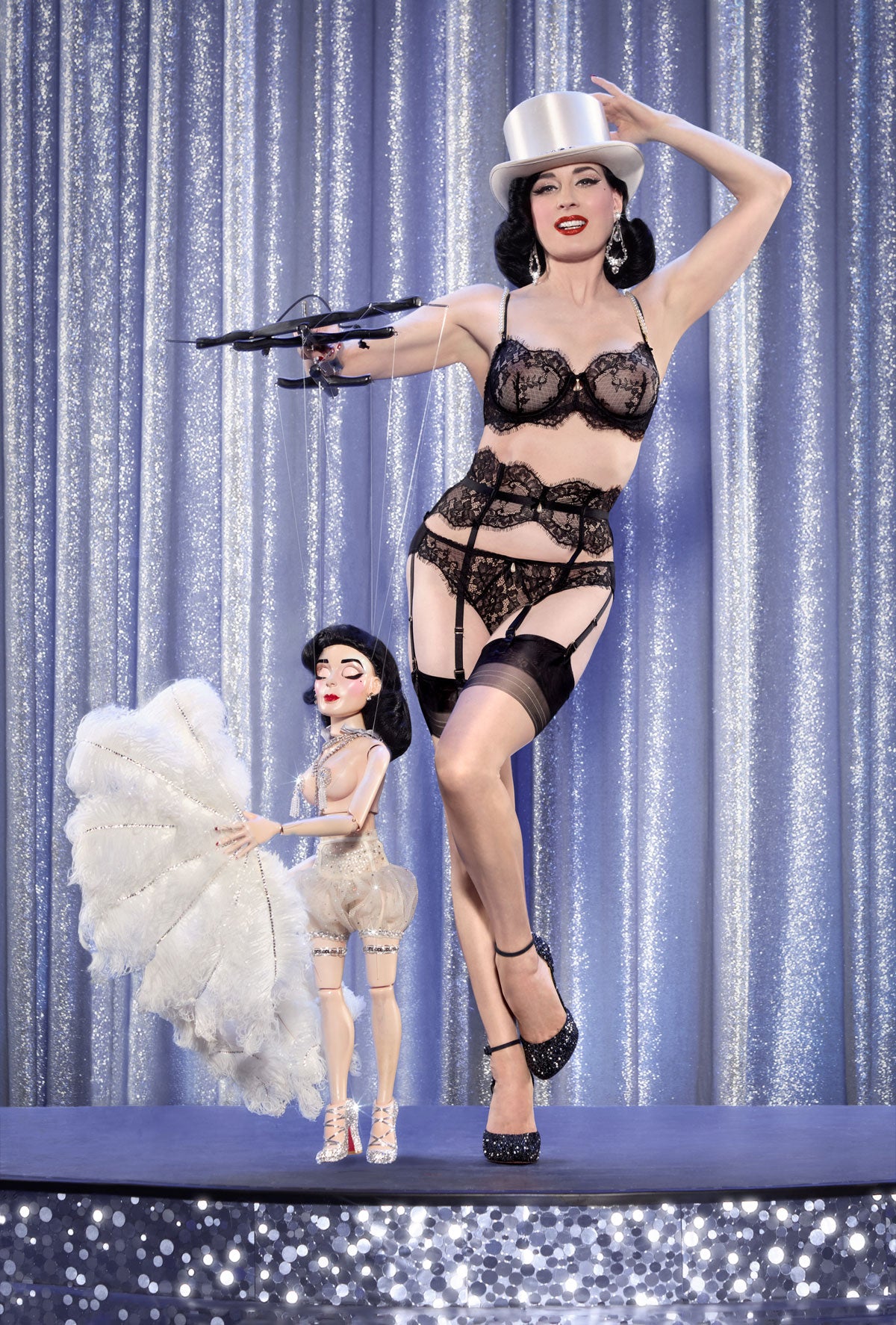 Dita Von Teese in Perlez Vous black lace bikini with garters, stockings, top hat, heels