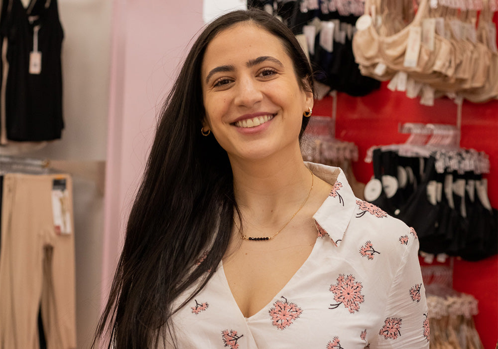 Bra fitter smiling in a lingerie store