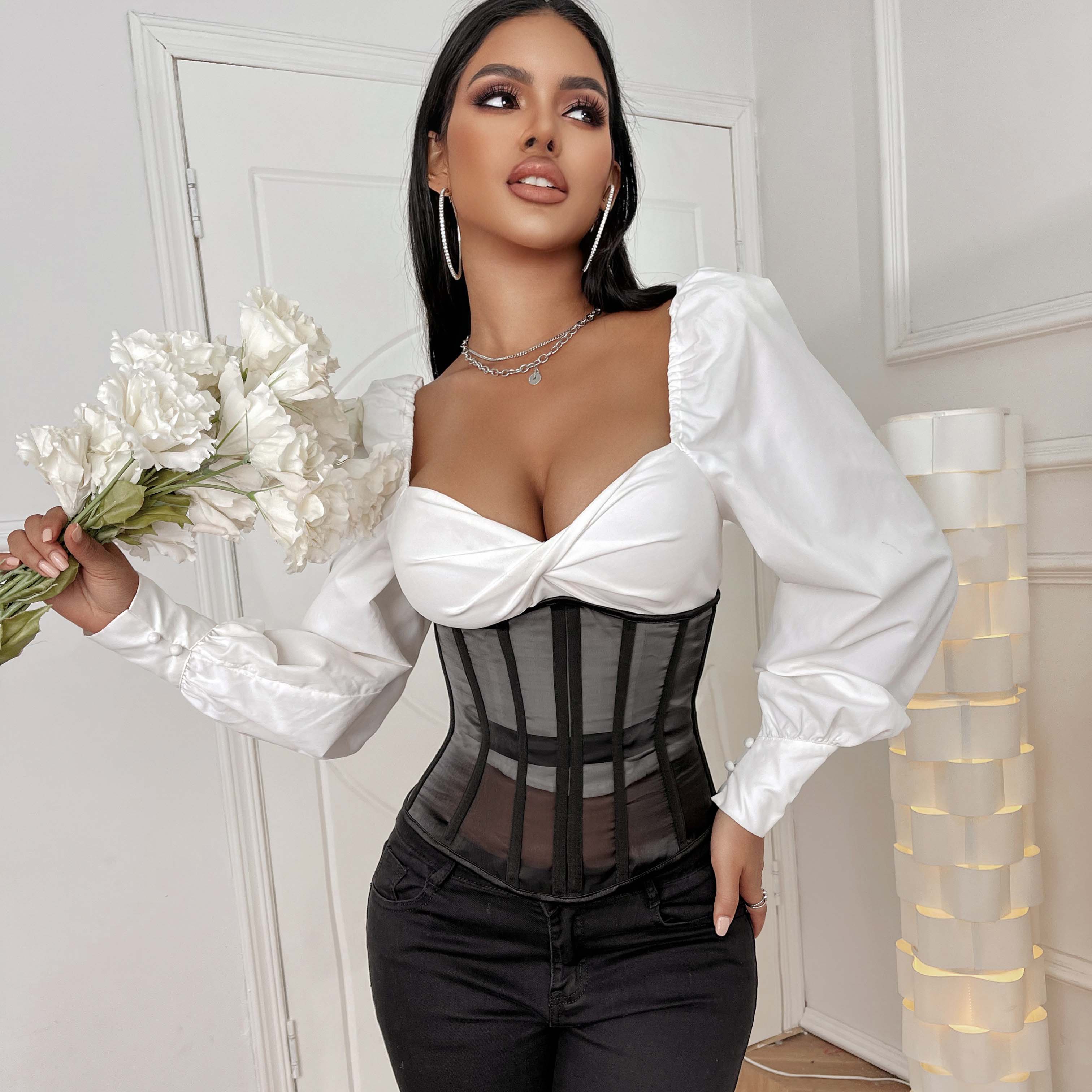 White satin blouse with puffy sleeves and a corset-style bodice from the sheer corset collection