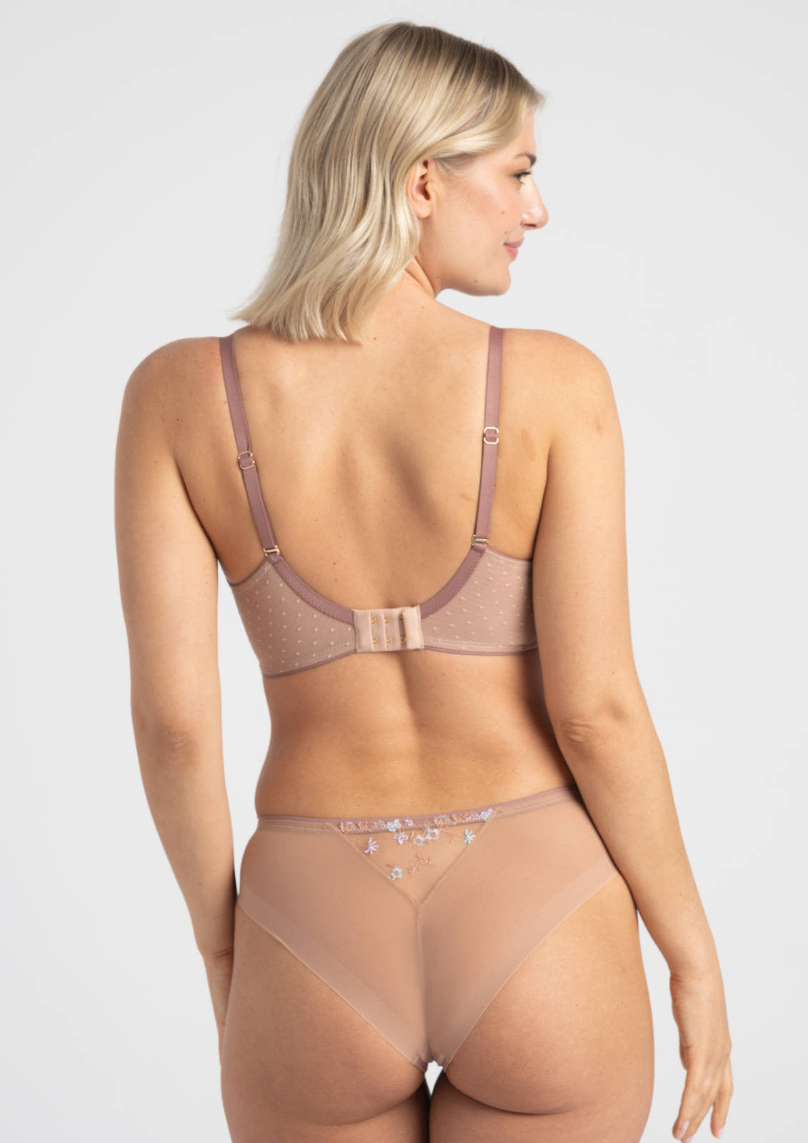 A delicate mauve lace margaret soft bra with thin straps and matching sheer mesh panties with star embellishments