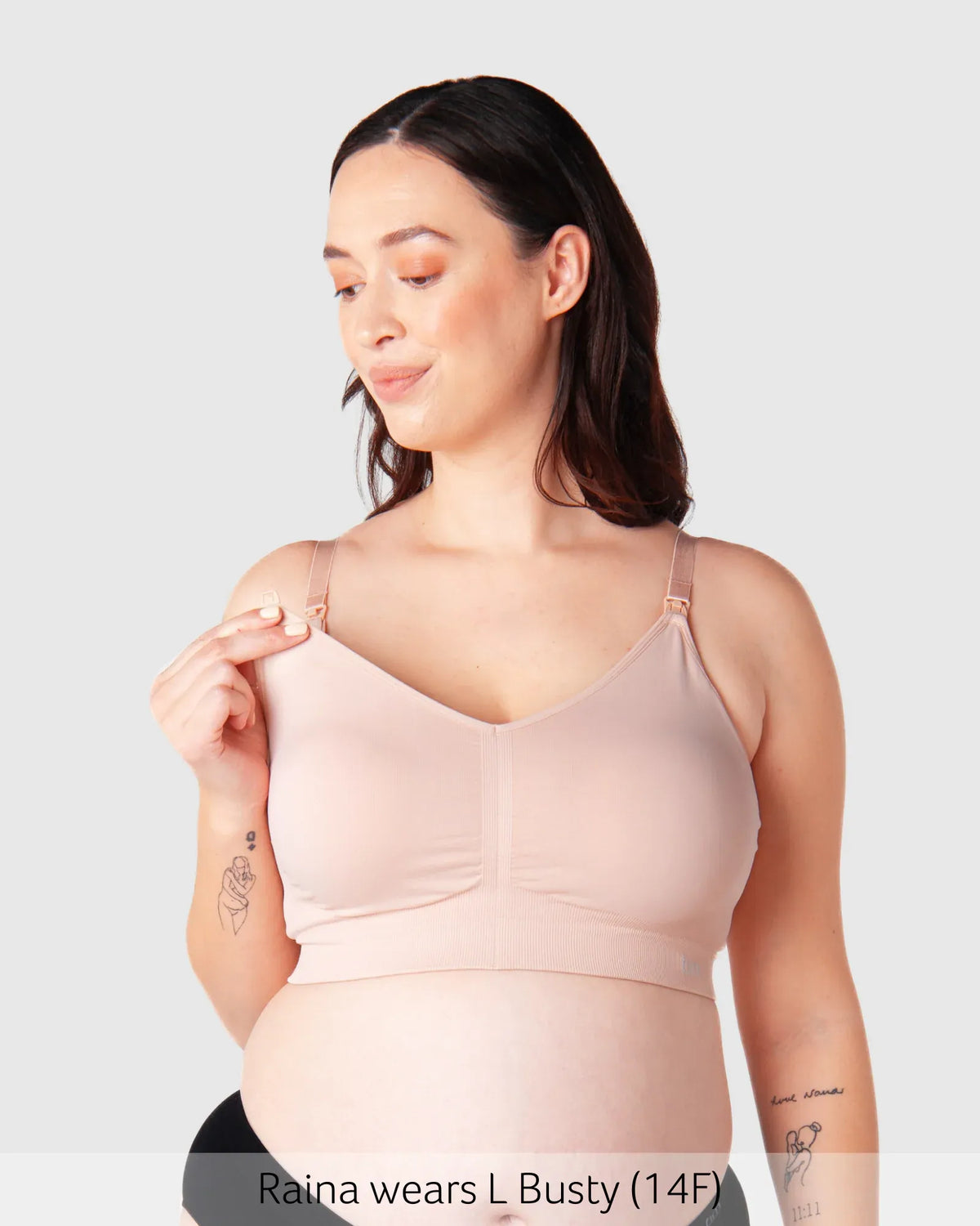 A soft blush pink seamless maternity nursing bra with adjustable straps and full supportive design by My Necessity