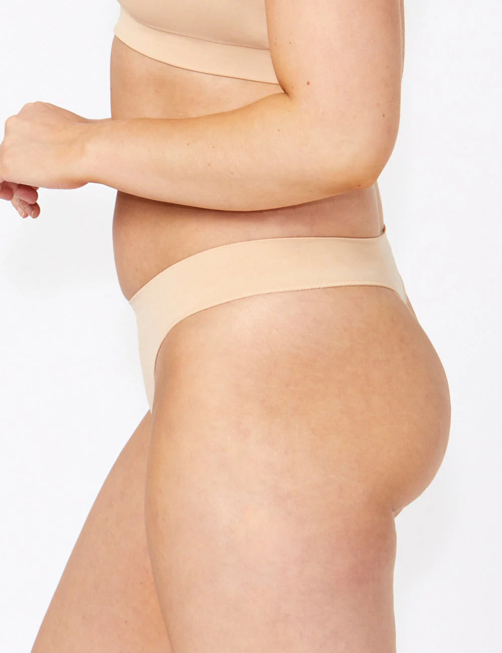 Bare Essentials G-String in beige seamless stretchy fabric