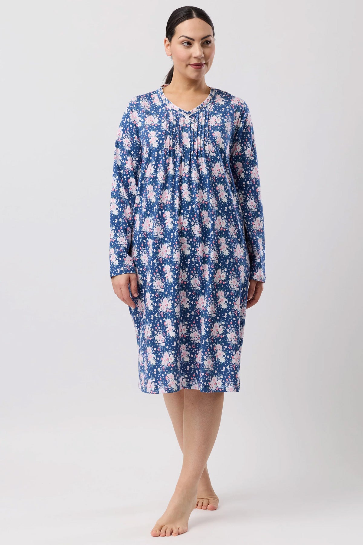 A navy blue bouquet crochet nightie with long sleeves floral pattern gathered neckline and flowing fabric