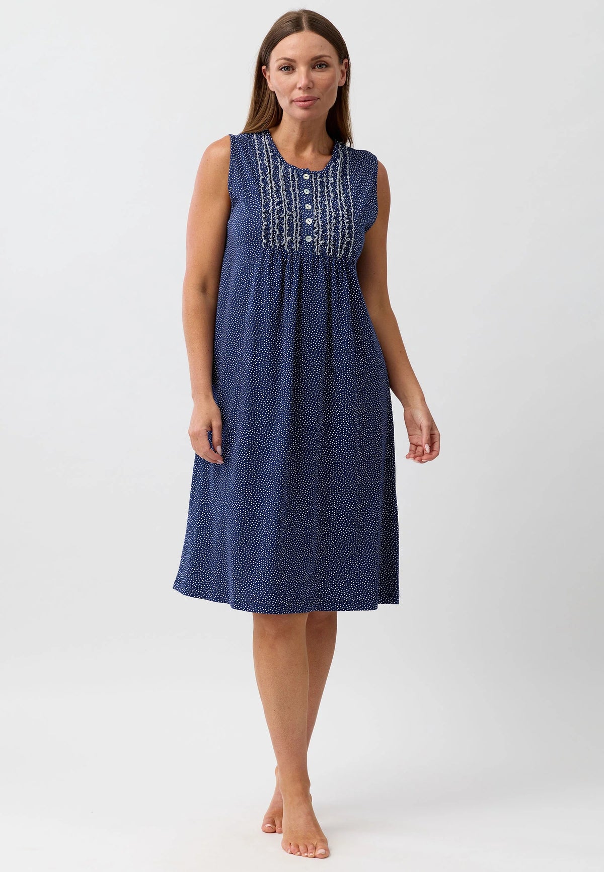 A navy blue confetti sleeveless nightie with a subtle speckled pattern and white embroidery along the neckline