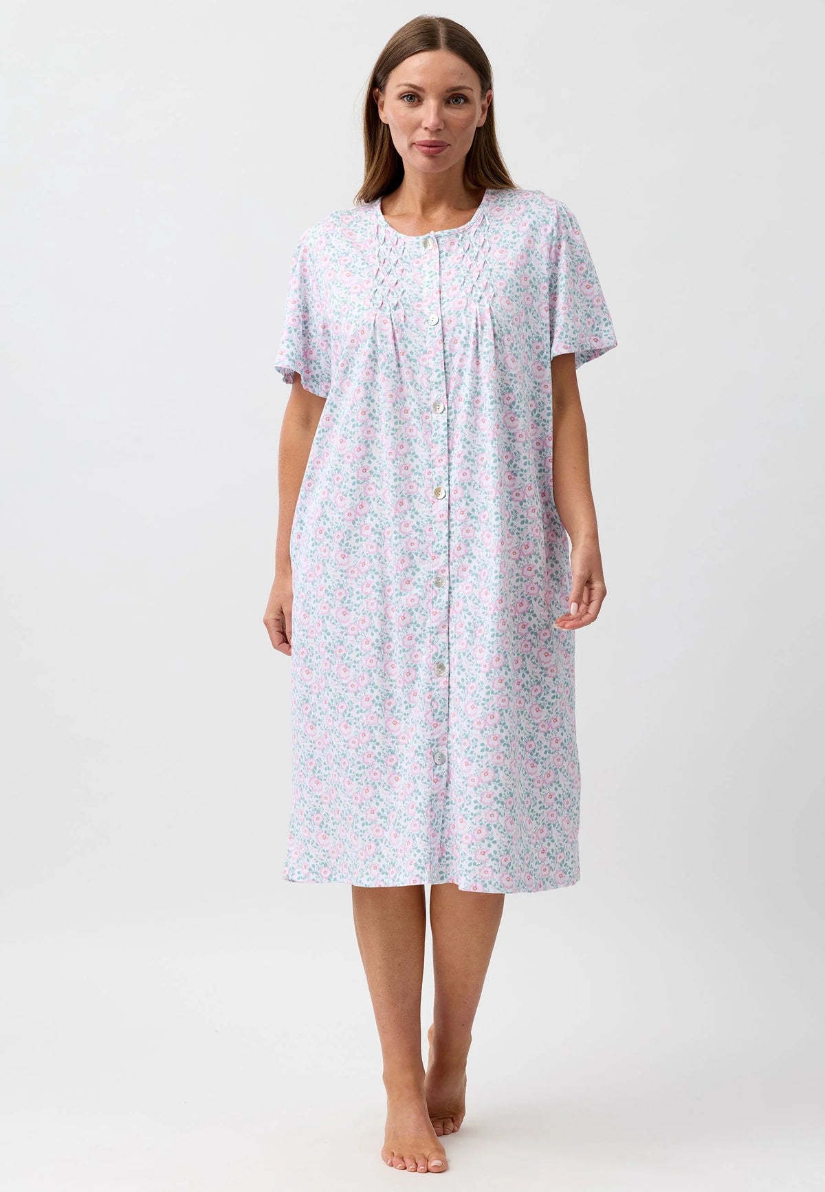 Camellia brunch coat in soft light blue fabric with pink and green floral pattern short sleeves and button-down front