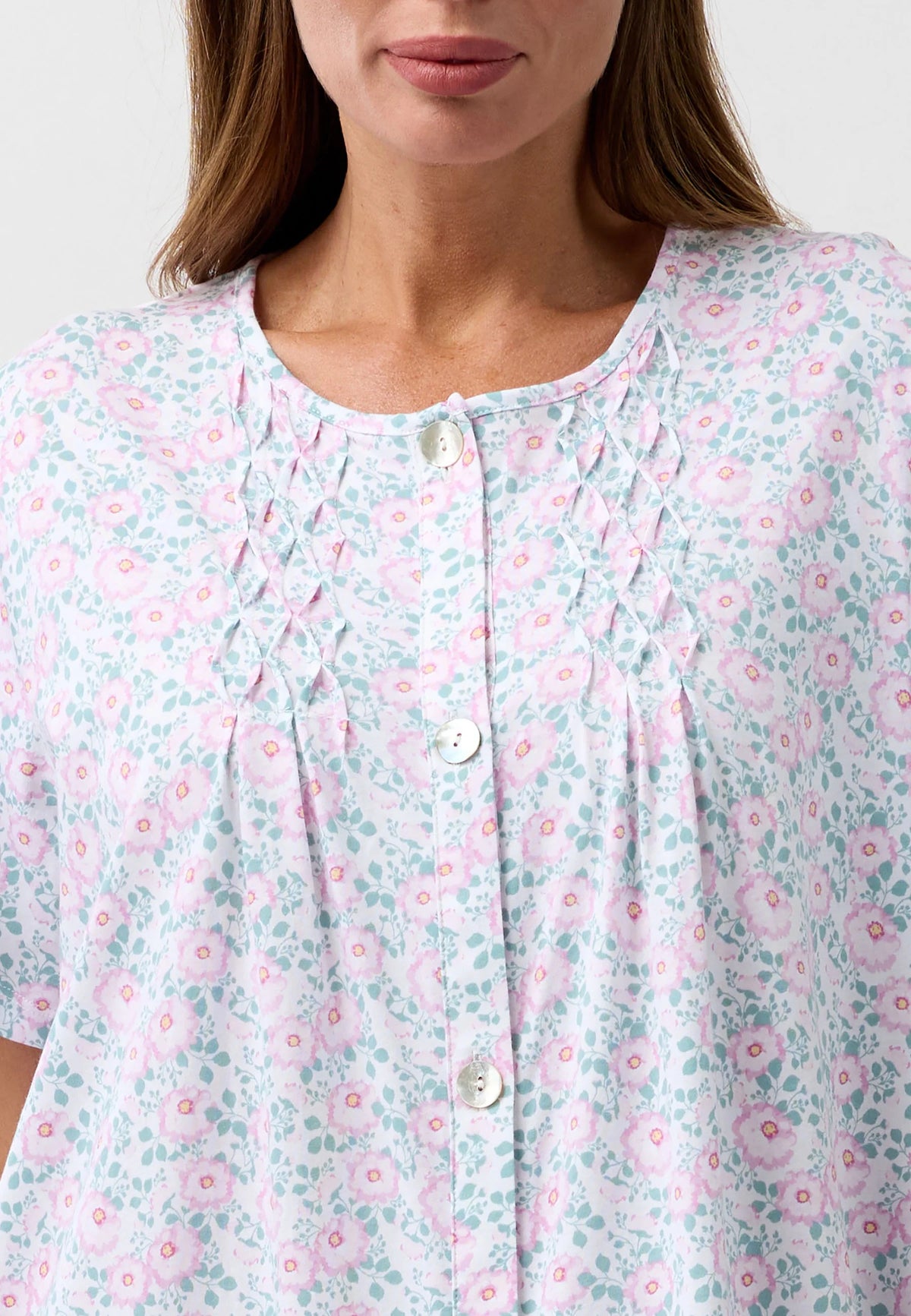 Camellia Brunch Coat soft light blue and pink floral print blouse with delicate smocking at the neckline