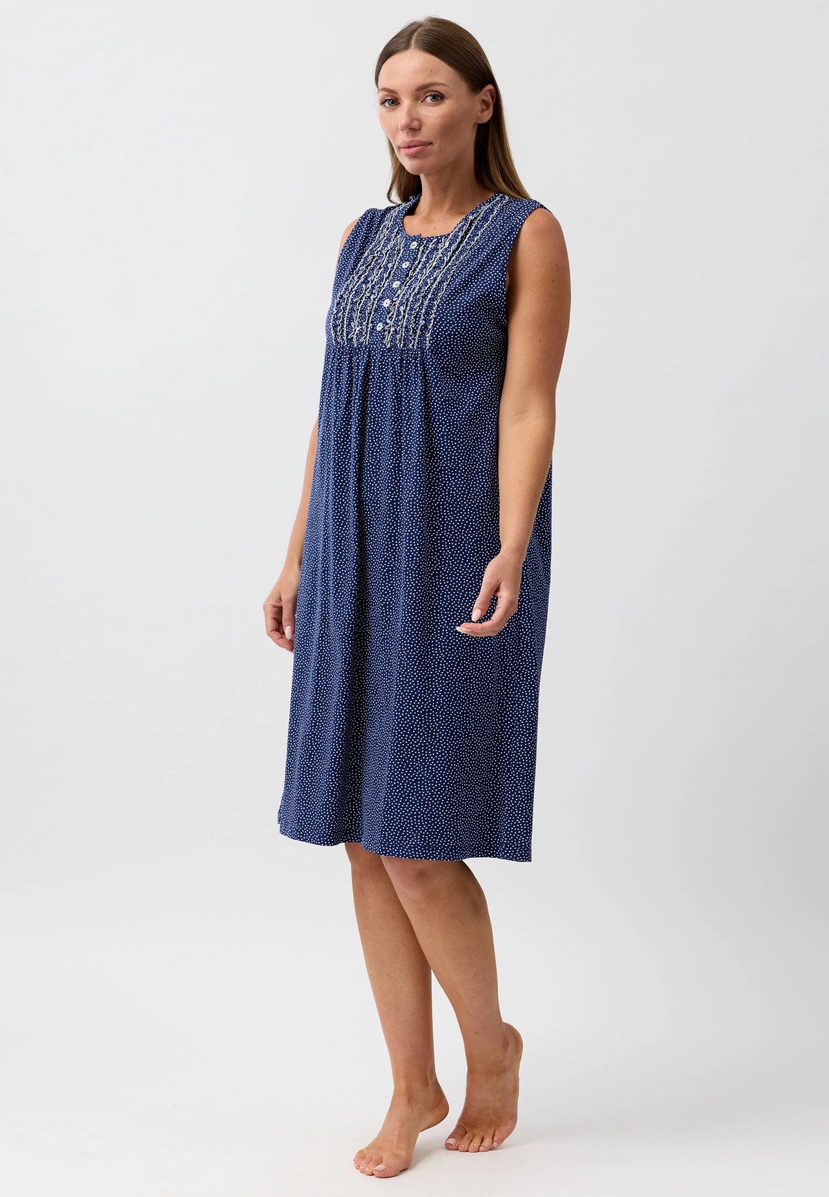 Confetti sleeveless nightie in navy blue with subtle texture and delicate white embroidery across the neckline