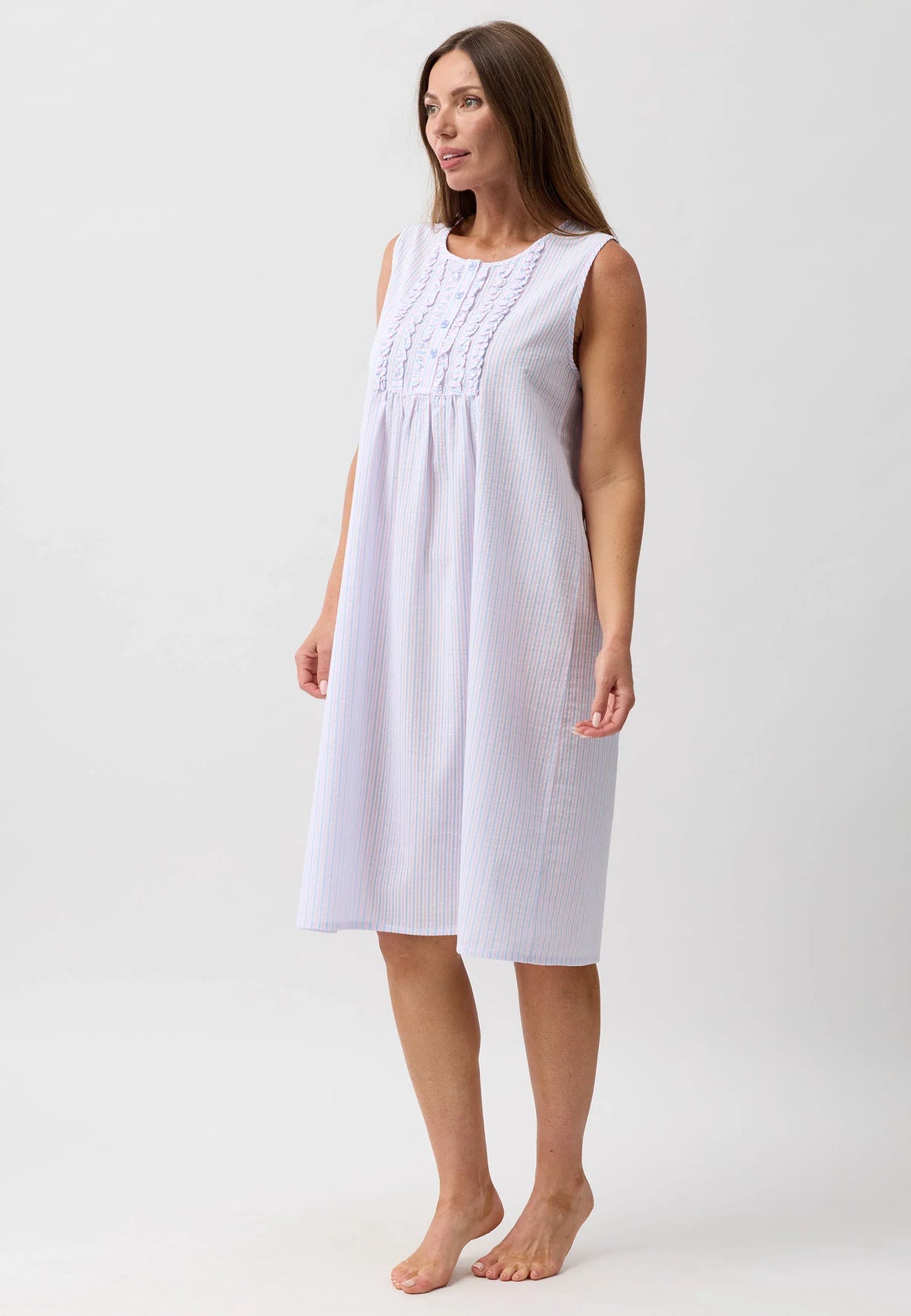 White sleeveless nightie with subtle vertical stripes and delicate embroidery at the neckline for comfortable sleepwear