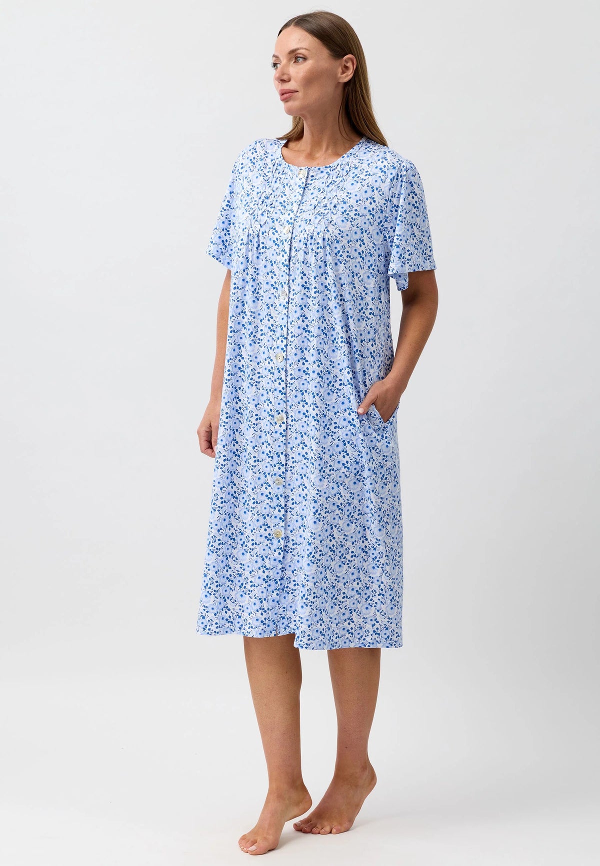 A light blue floral print nightgown with short sleeves and button-down front in the Camellia Brunch Coat style